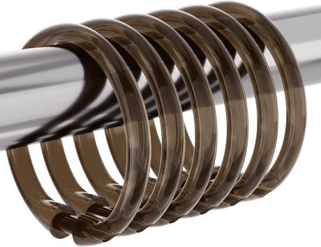 AmazerBath Amber Brown plastic shower curtain rings grouped on a metal rod, showing the rounded profile and snap closures.