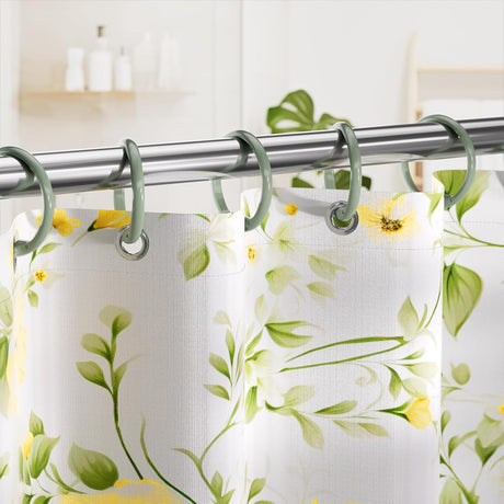 AmazerBath Sage Green plastic shower curtain rings holding a floral shower curtain across a polished metal rod.