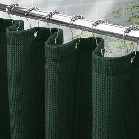 AmazerBath Dark Green waffle shower curtain with a folded top hem, textured fabric, metal grommets, and hooks on a rod.