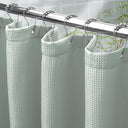 AmazerBath Grayish Green waffle shower curtain with a folded top hem, textured fabric, metal grommets, and hooks on a rod.
