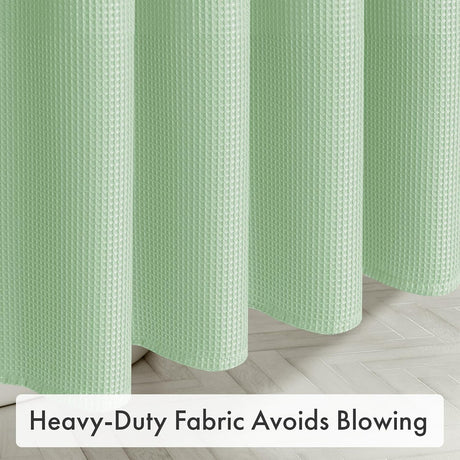 AmazerBath Mint Green waffle shower curtain with thick lower folds hanging steadily near the bathroom floor.