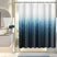 A shower curtain with a gradient of gray shades, darker at the bottom and lighter at the top, hanging on a rod in a bathroom setting.