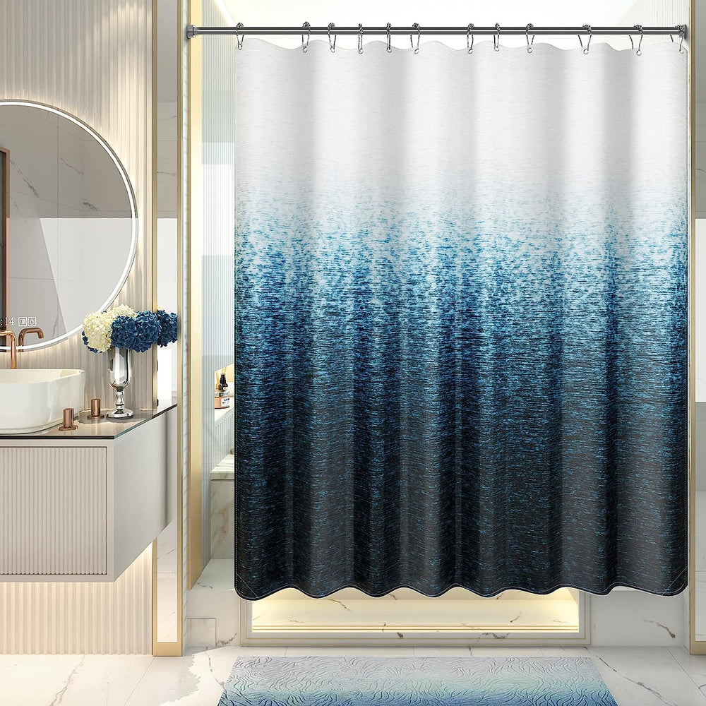 A shower curtain with a gradient of gray shades, darker at the bottom and lighter at the top, hanging on a rod in a bathroom setting.