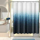 A shower curtain with a gradient of gray shades, darker at the bottom and lighter at the top, hanging on a rod in a bathroom setting.